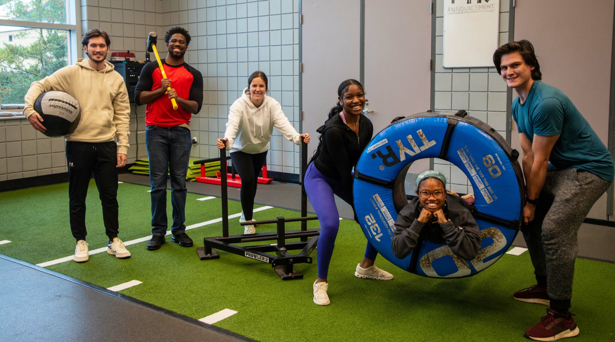 Multiple students with exercise equipment.